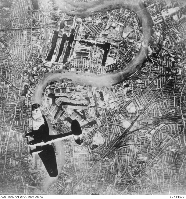 Aerial photograph of a Heinkel 111 aircraft of the German Air Force (Luftwaffe) over London's dockland during the Battle of Britain.