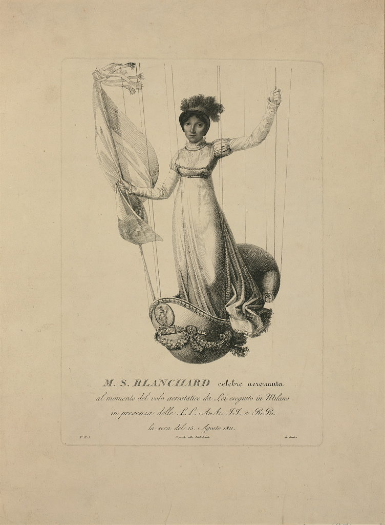 Black and white drawing of a woman in a white dress standing in a balloon basket. One hand holds a flag and the other hand is raised, holding onto a support rope.